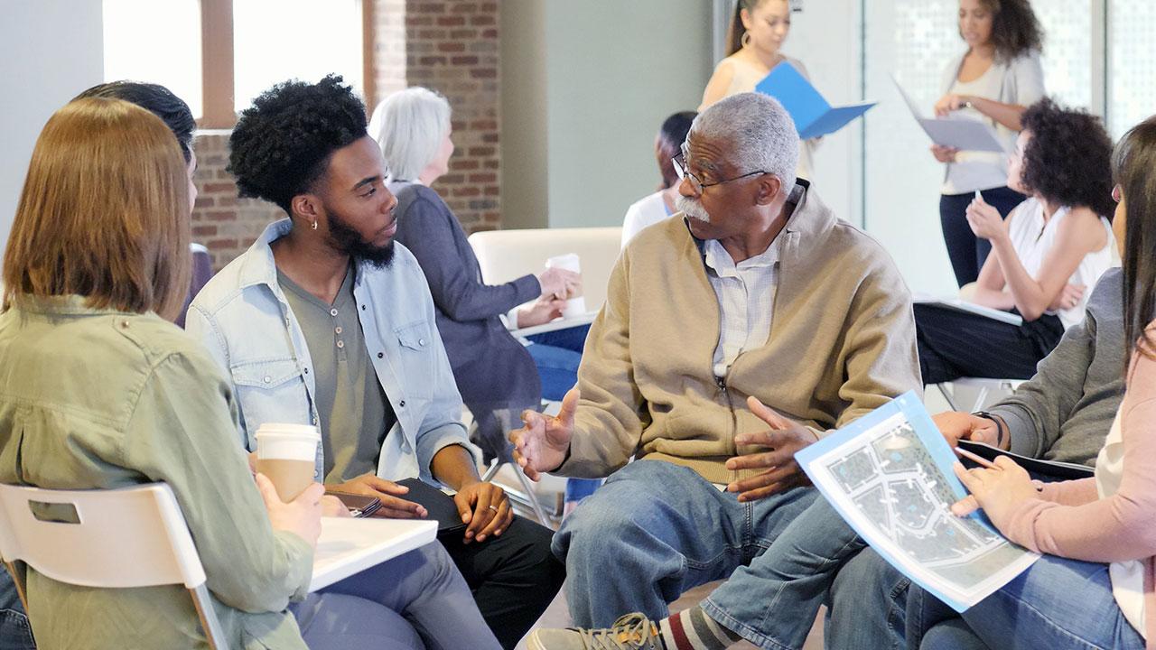 Community members and stakeholders review and discuss hazard mitigation plans in public workshop